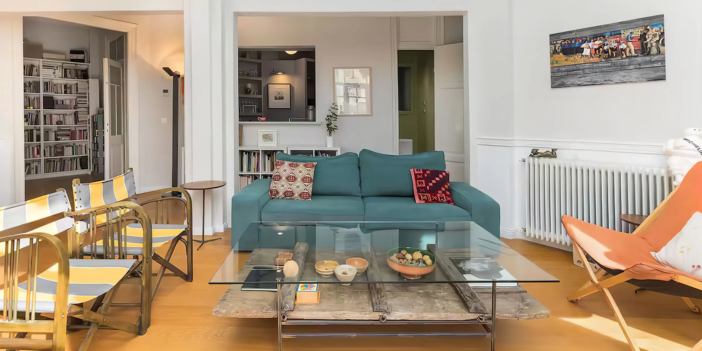 Neoclassical interior with high ceilings and chandelier at the Basquiat property