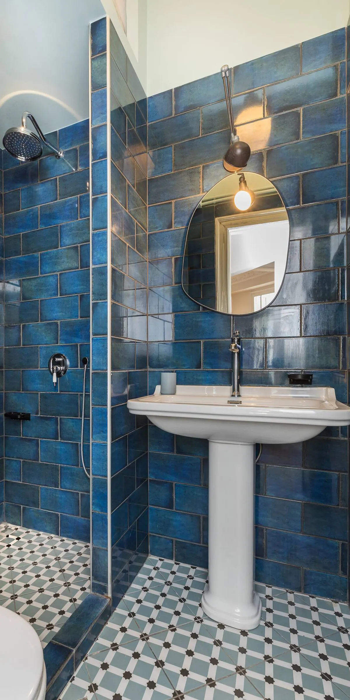 Vibrant blue bathroom vanity area at the Basquiat property
