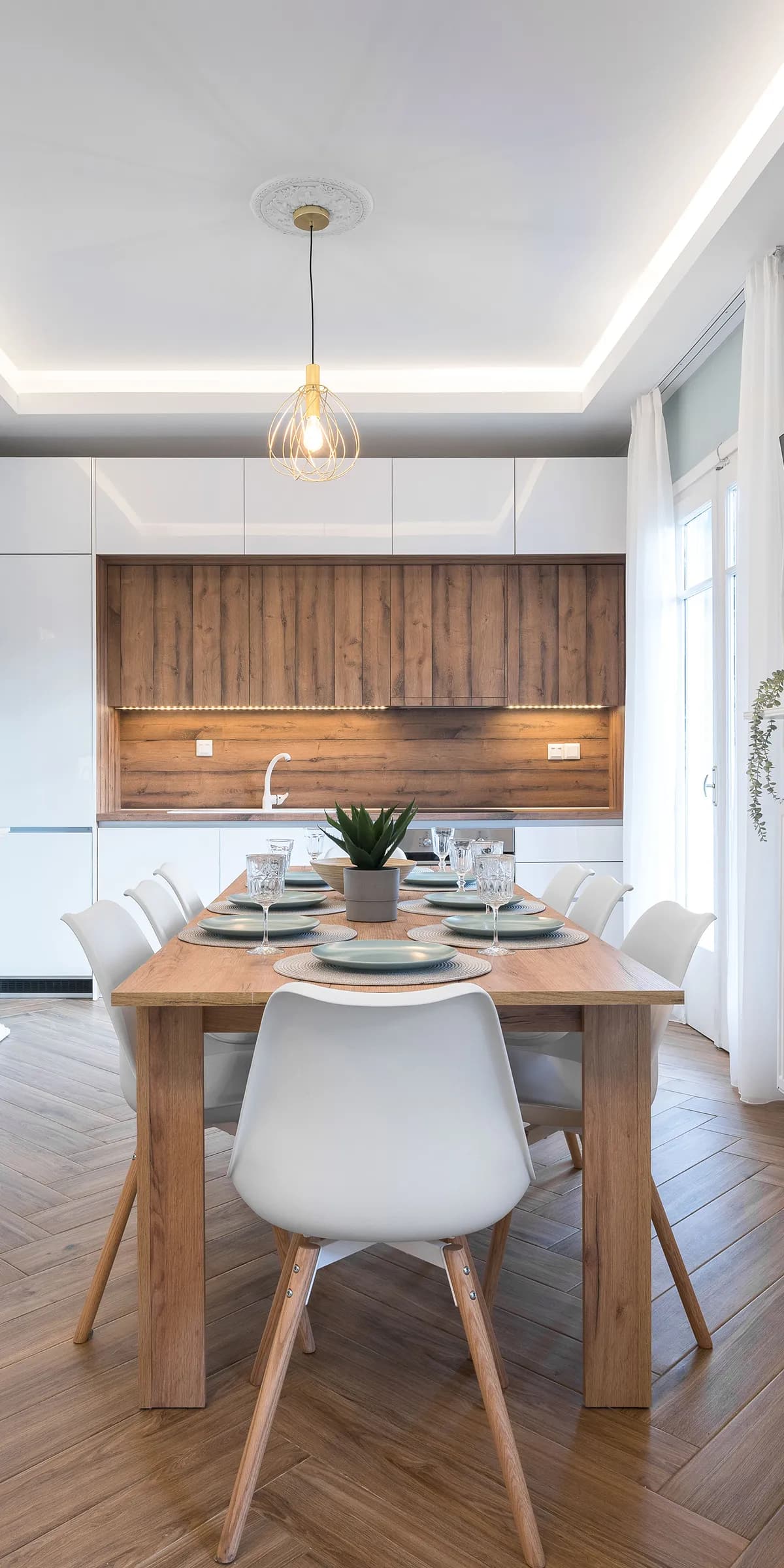 Kitchen area in the Deka Apartment with wood accents